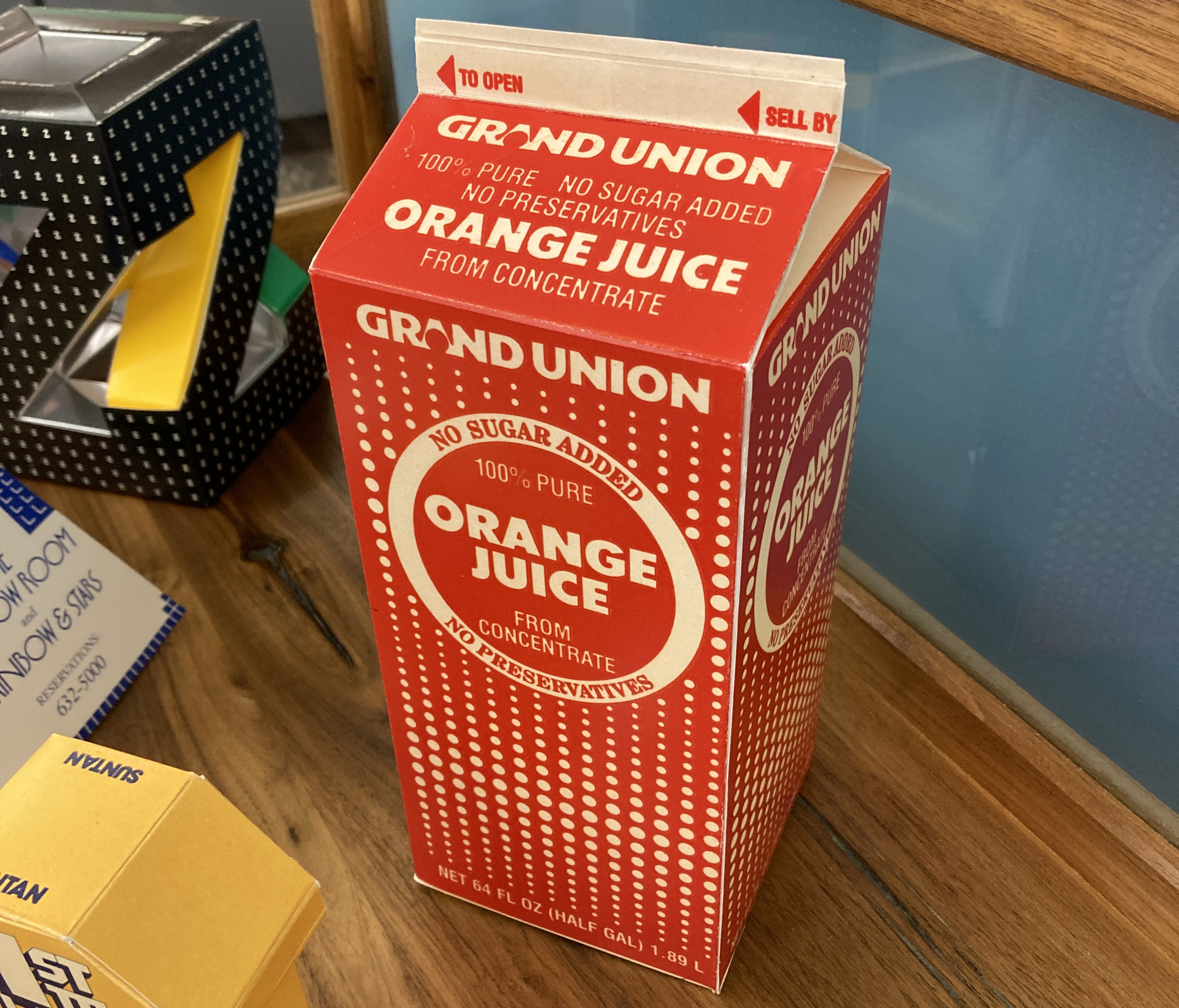a red and white grand union carton of orange juice